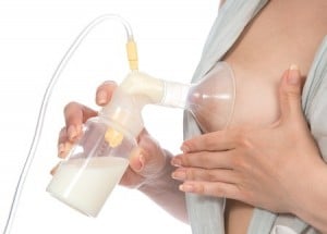 A woman using a breast pump